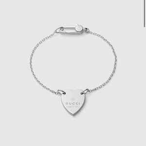 Sterling silver Gucci trademark bracelet with heart tag